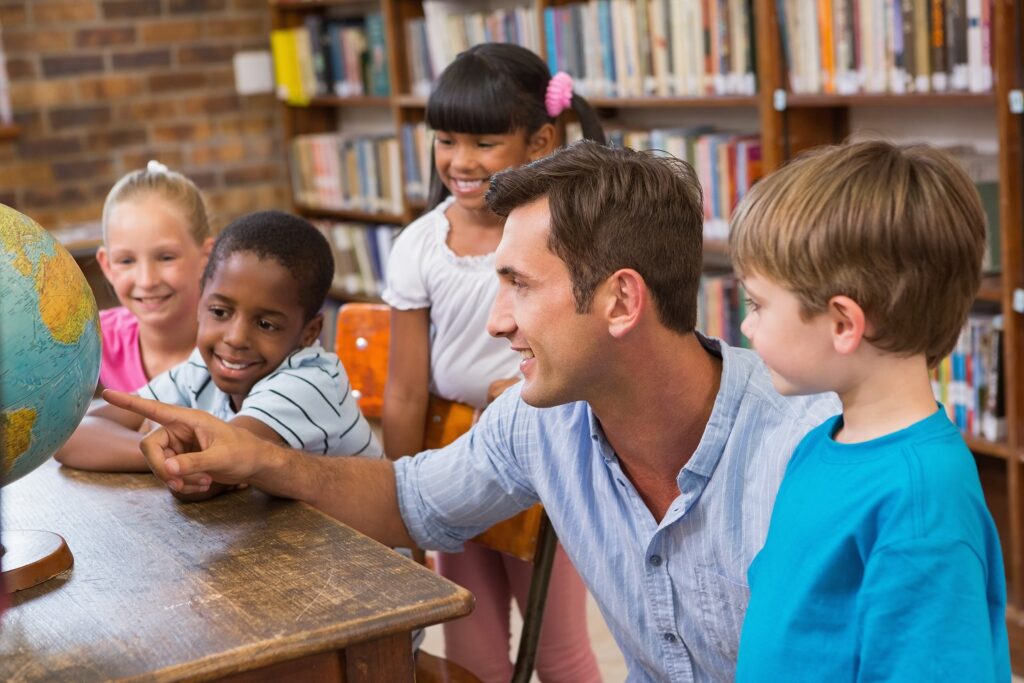 Male teacher with students