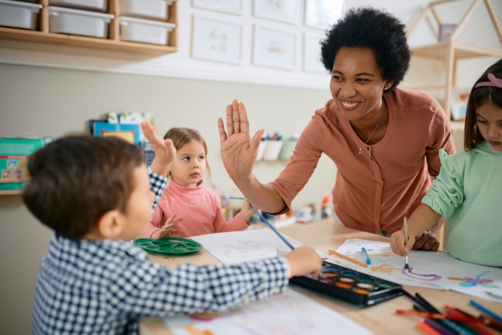 Teacher leading a class of young students